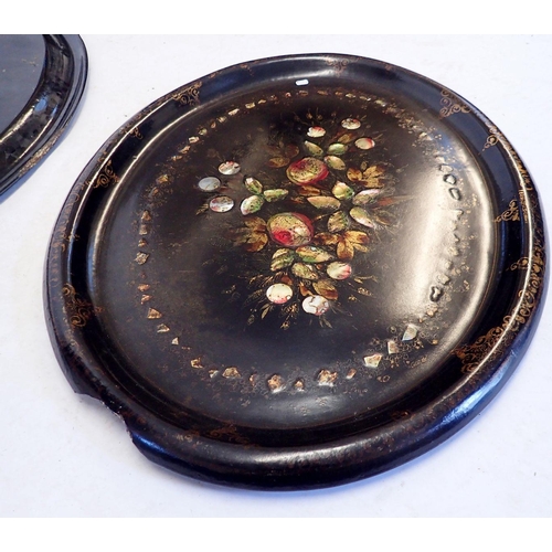 1152 - Two Victorian oval papier Mache trays inlaid with mother of pearl and painted flowers within gilt bo... 