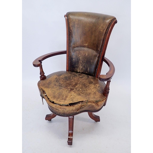 1155 - An early 20th century Irish swivel desk chair, the mahogany arms with marquetry decoration, all rais... 