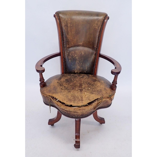 1155 - An early 20th century Irish swivel desk chair, the mahogany arms with marquetry decoration, all rais... 