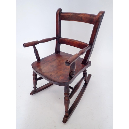 1163 - A child's slat back chair