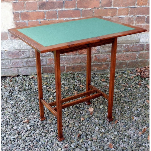 1165 - An Edwardian Liberty Style oak fold top card table with pierced heart motif, 53 x 38 x 74cm closed, ... 