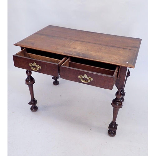 1166 - A 17th century side table with two drawers on inverted baluster supports, 96 x 58cm