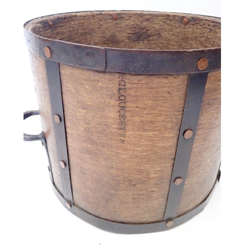 1179 - A Victorian wood and metal bound grain measure, stamped '8 Gallon VR Gloucester' 33cm tall