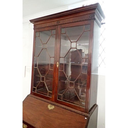 1181 - A George III mahogany bureau bookcase, the carved cornice over pair of astragal glazed doors, the ba... 