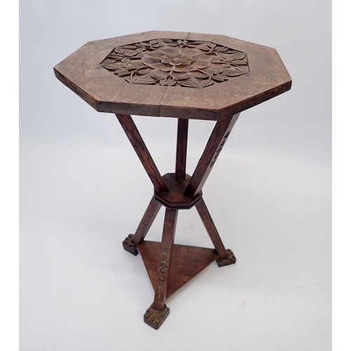 1193 - A Victorian walnut carved octagonal gypsy table on triple carved gothic supports