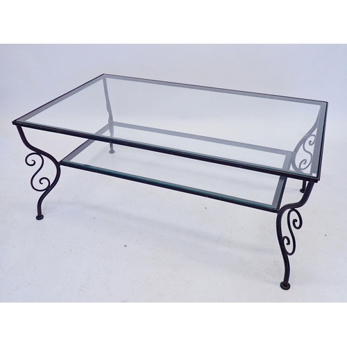 1195 - A modern wrought iron and glass coffee table, 101 x 62 x 42cm