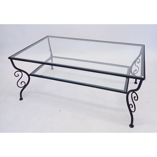 1195 - A modern wrought iron and glass coffee table, 101 x 62 x 42cm