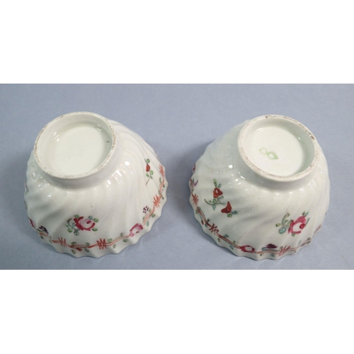 121 - A pair of 18th century English porcelain tea bowls painted flowers with pink ribbon and flower borde... 