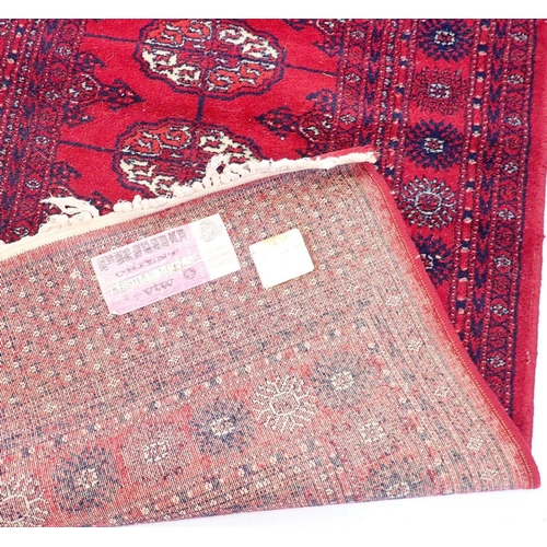 1212 - A Prado Orient Keshan super wool rug of red ground, 175 x 90cm