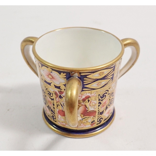 126 - A Royal Crown Derby miniature three handled tyg, 4cm tall