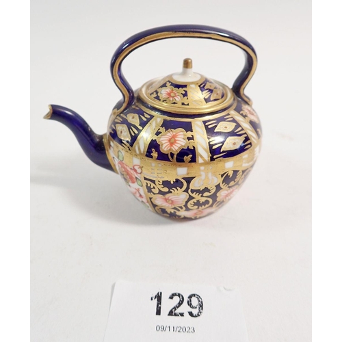 129 - A Royal Crown Derby miniature tea kettle, 6.5cm tall