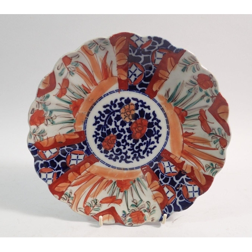 149 - A Japanese Imari fluted plate, 21.5cm diameter