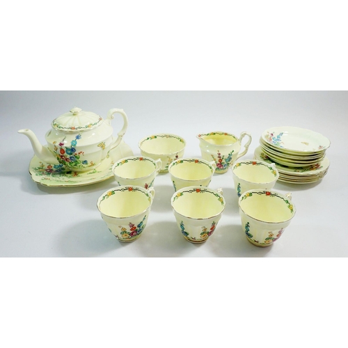 17 - A Crown Staffordshire tea service comprising teapot, six cups and saucers, jug, sugar, six tea plate... 