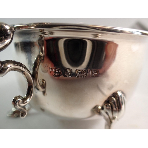 256 - A silver sauce boat with scroll over handle and hoof feet, Birmingham 1939, by S Blanckensee & Son L... 