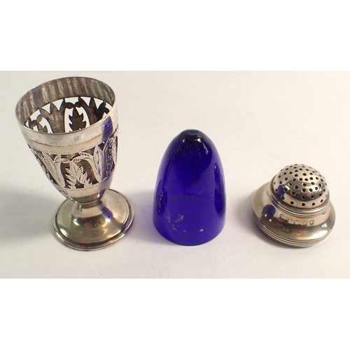 310 - A Victorian silver circular form pepper pot with pierced leaf panels and blue glass liner, London 18... 