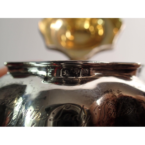 315 - A silver tea caddy of bombe form on paw feet engraved 'Presented to the Lady Workers of St Michaels ... 