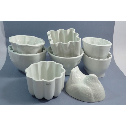 32 - Eight ceramic jelly moulds including one Shelley mould plus a Greens chicken on a basket