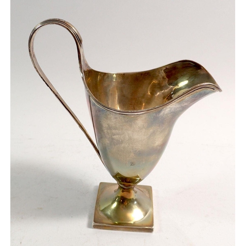 323 - A George III silver cream jug of helmet form on square base, London 1802, 102g