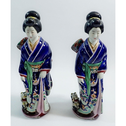 33 - A pair of Japanese pottery Geisha figures in traditional robes, one a/f 25cm tall