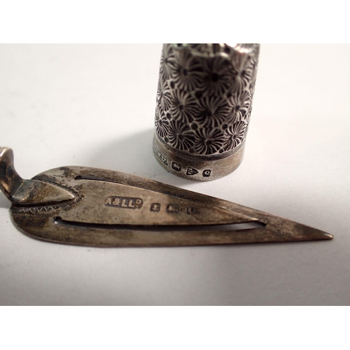 334 - A silver and mother of pearl trowel form book mark, Birmingham 1913, 7cm and a silver thimble Cheste... 