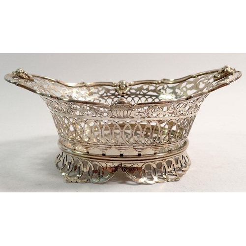 339 - A 19th century Dutch 833 standard silver pierced oval basket with scrollwork and mask decoration, 14... 