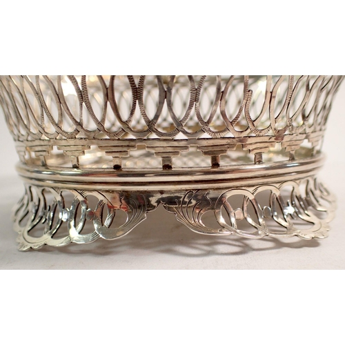 339 - A 19th century Dutch 833 standard silver pierced oval basket with scrollwork and mask decoration, 14... 