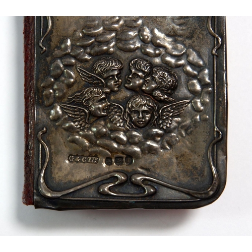 343 - A miniature leather prayer book with embossed silver front decorated winged angels, Birmingham 1905