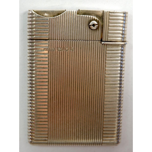 348 - An Asprey silver wafer lighter, engine turned decoration, 46.4g, London 1956