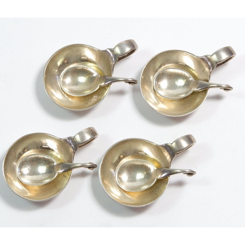 351 - A set of four early 20th century Georg Jensen silver salts with looped handles and matching spoons, ... 