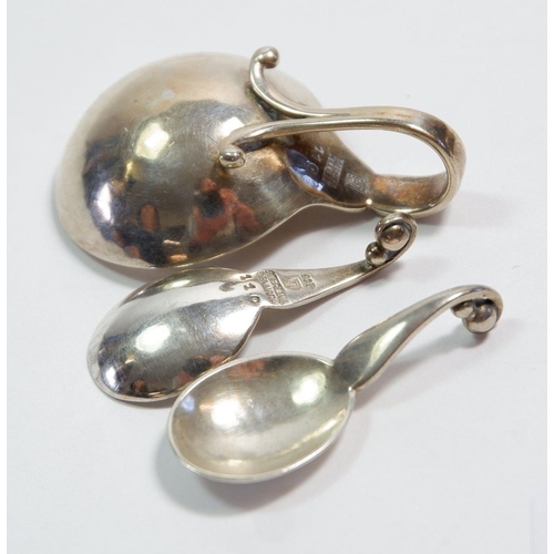 351 - A set of four early 20th century Georg Jensen silver salts with looped handles and matching spoons, ... 