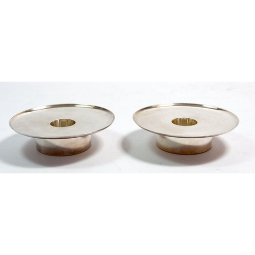 363 - A pair of mid century Georg Jensen silver candle holders of circular design, No 1157, 9cm diameter, ... 