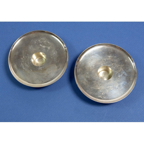 363 - A pair of mid century Georg Jensen silver candle holders of circular design, No 1157, 9cm diameter, ... 