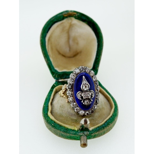 378 - An antique 18 carat gold and enamel ring silver set with old cut diamonds, the central Fleur De Lys ... 