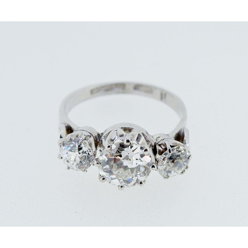 379 - A fine quality platinum set three stone diamond ring, 2.5 cts in total, size M