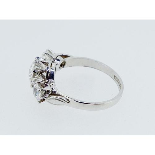 379 - A fine quality platinum set three stone diamond ring, 2.5 cts in total, size M