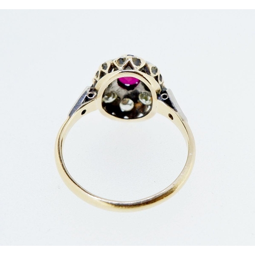 380 - An antique 18 carat gold ruby and diamond oval cluster ring, size L to M, cluster 1.2 x 1cm