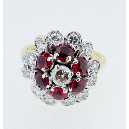 381 - An 18 carat gold ruby and diamond cluster ring, size K, 6.4g