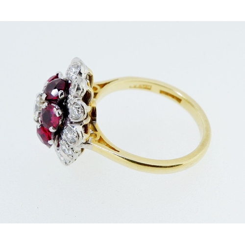 381 - An 18 carat gold ruby and diamond cluster ring, size K, 6.4g