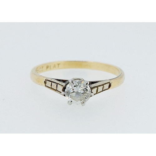 385 - An 18 carat gold and platinum set diamond solitaire ring, size M, 1.9g