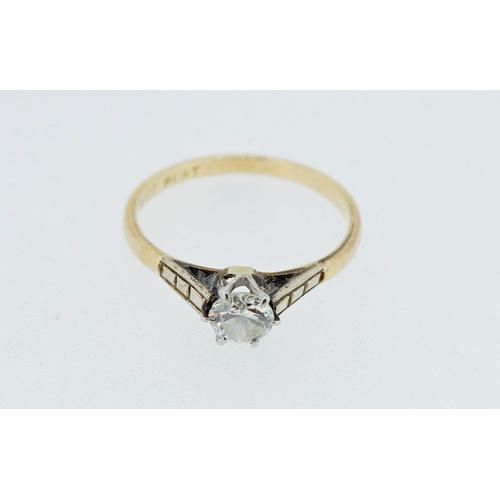 385 - An 18 carat gold and platinum set diamond solitaire ring, size M, 1.9g