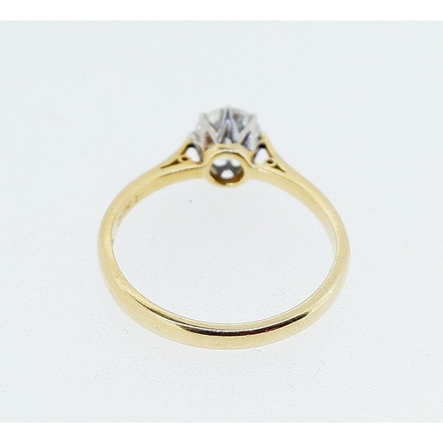 390 - An 18 carat gold solitaire diamond ring, 65 pts, size I to J, 1.8g