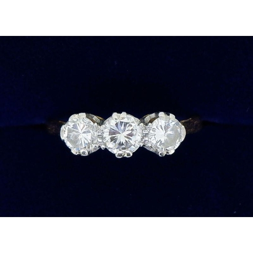 394 - An 18 carat gold and platinum set three stone diamond ring, approx 3/4 carats, size N to ), 3g, ring... 