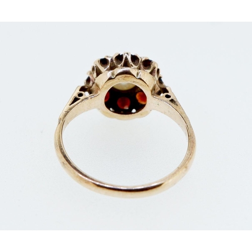 397 - A 9 carat gold pearl and garnet cluster ring, size K to L, 3.3g