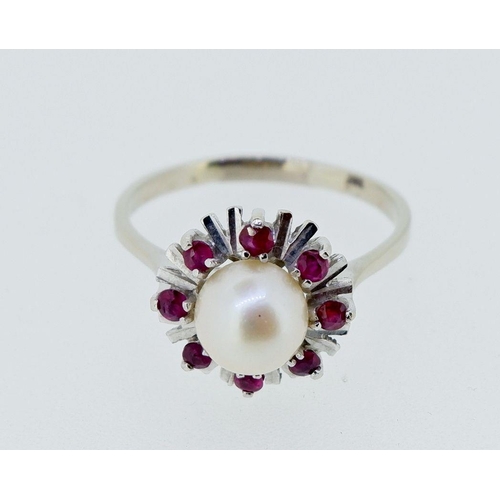 399 - A vintage 14k white gold ring set pearl within star and red stone surround, 2.8g, size P to Q