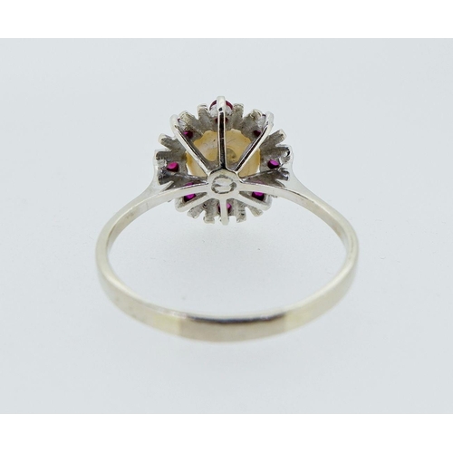 399 - A vintage 14k white gold ring set pearl within star and red stone surround, 2.8g, size P to Q