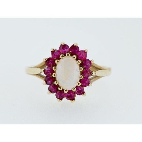 400 - A 9 carat gold opal and garnet cluster ring, 2.8g, size N-O