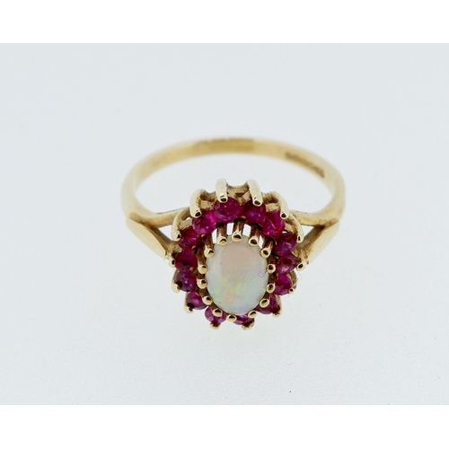 400 - A 9 carat gold opal and garnet cluster ring, 2.8g, size N-O