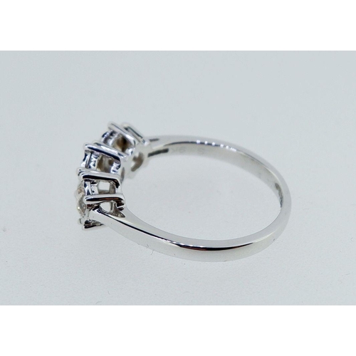 403 - A 9k white gold ring illusion set three diamonds (total approx 0.5 carat) size K