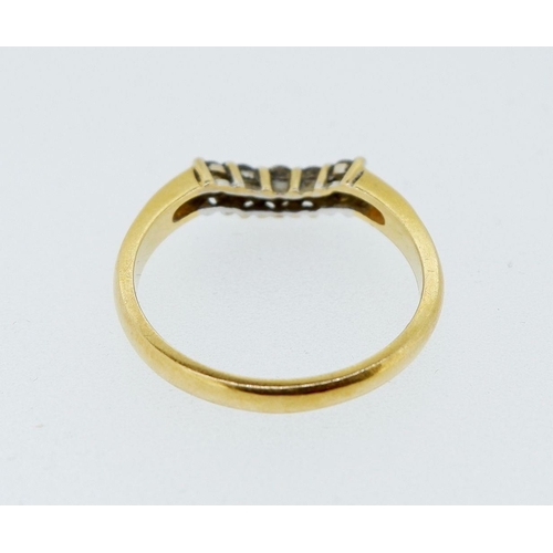 412 - An 18 carat gold ring set curved line of five diamonds, size P, 3.2g