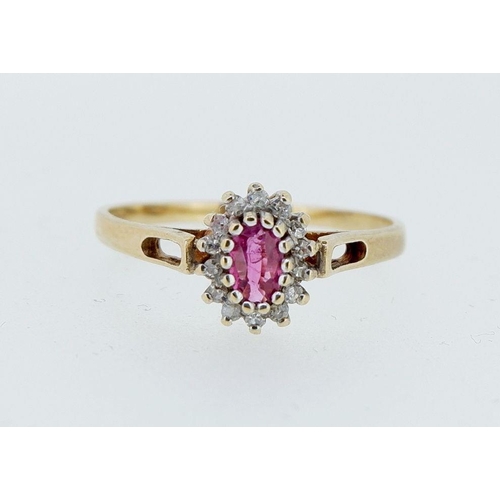 413 - A 9 carat gold oval cluster ring set ruby and diamonds, size O-P, 1.7g